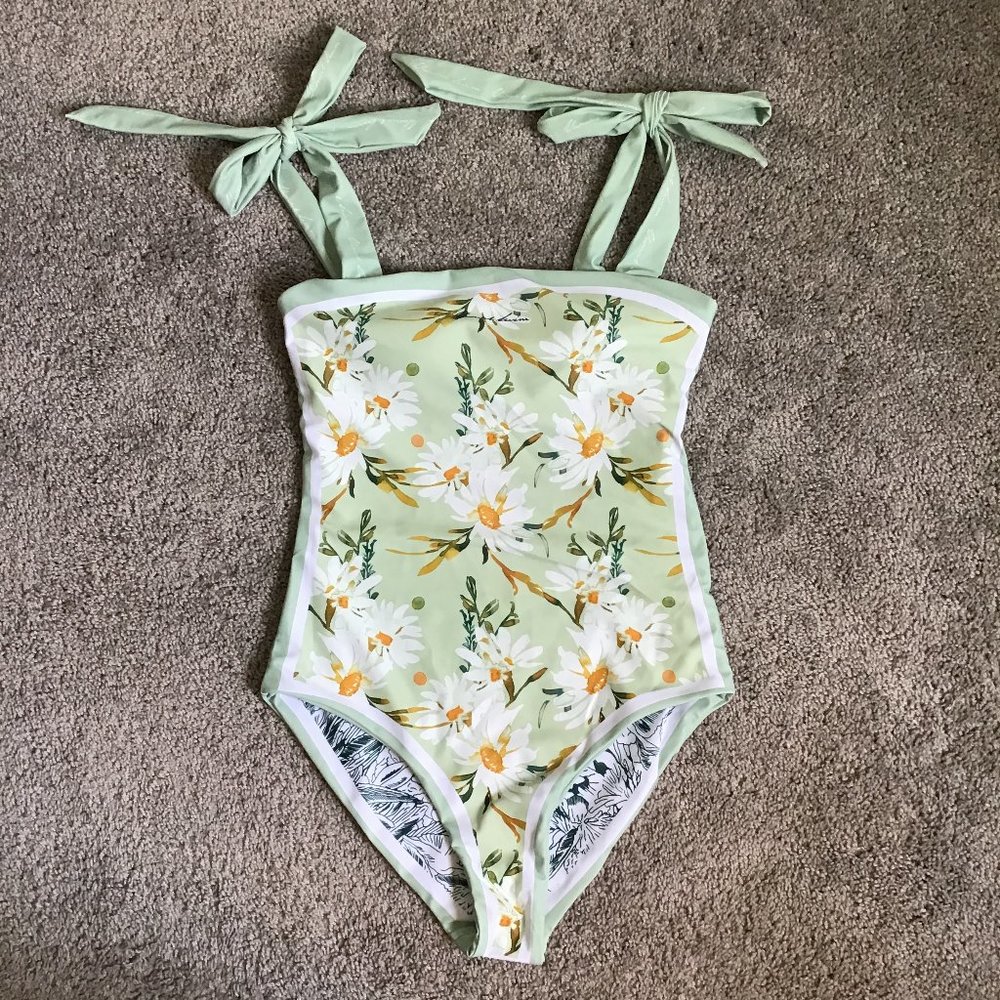 Reversible green and white floral one piece swimsuit with tie strap shoulders